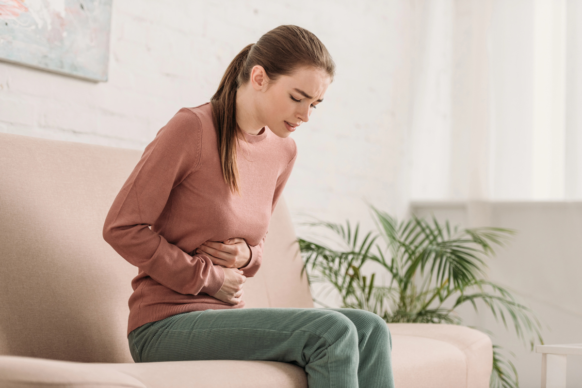 woman in pain that needs Gastroenterologist In Westchester County, Serving Bronxville, New Rochelle, White Plains, Yonkers, NY, and the Surrounding Areas